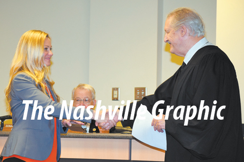 Burns takes oath as new council member