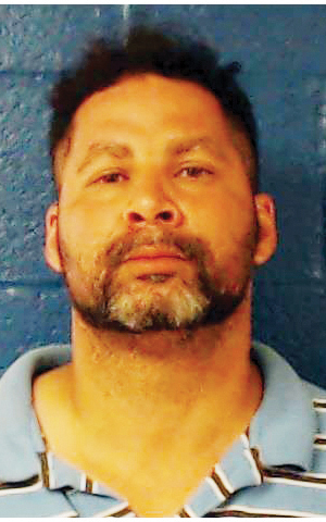 Two charged with woman's death