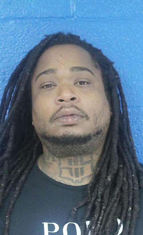 Murder suspect charged with drugs during traffic stop