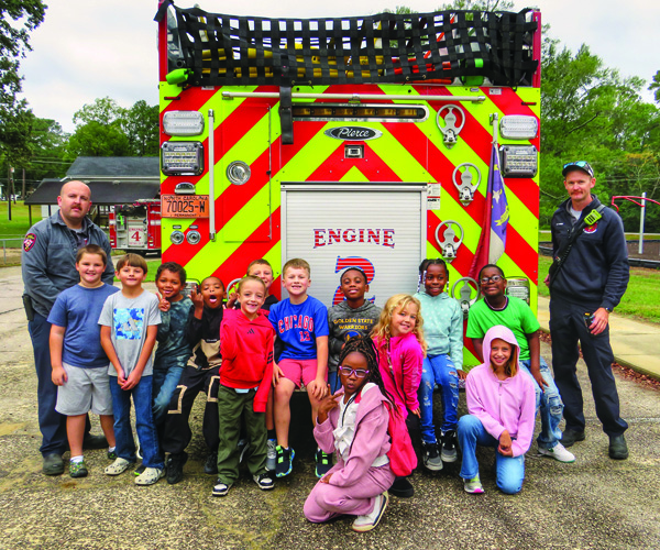 Nashville Firefighters pose with Nashville Elementary students during Fire Protection Week 2025