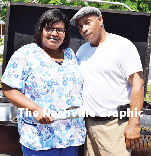 Man feeds lunch to residents of Trinity Villas in Nashville
