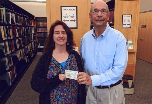 Books and check presented