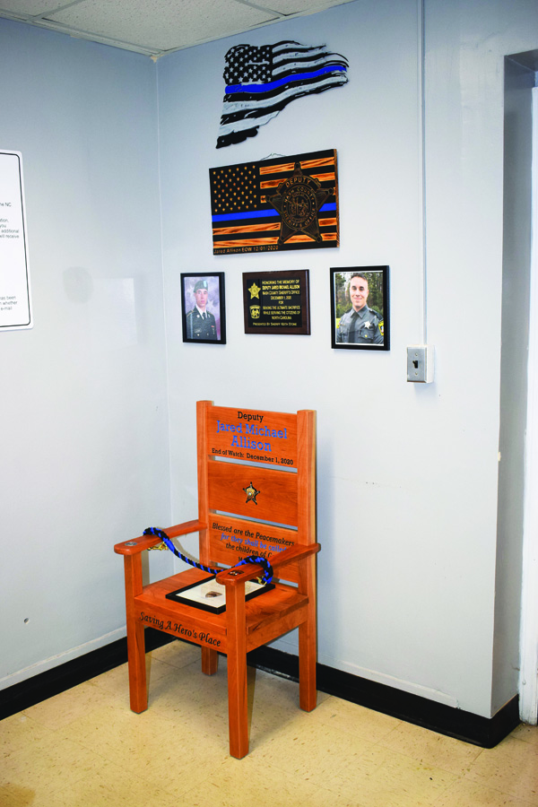 A HERO'S PLACE<BR>Honor chair is dedicated for fallen deputy