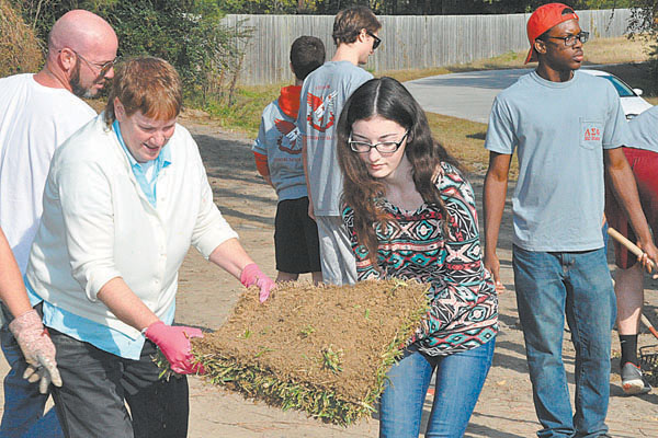 Community and volunteers landscape home for local veteran