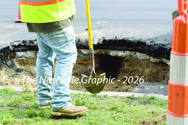 NCDOT crew repairs large hole in downtown street