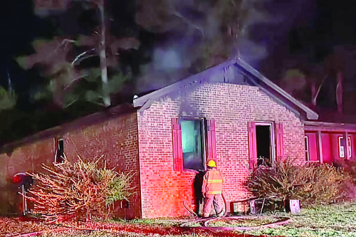 Man pulled neighbor from burning home