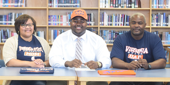 NC's Floyd signs with Trojans